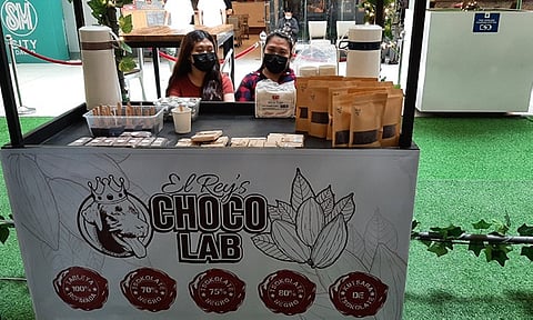 NEW PLAYER. Among the Chocolate Fair exhibitors is up and coming El Ray's Chocolab with their innovative Kutsara de Tsokolate instant cacao drink product. (Photo by Iona Mendoza)
