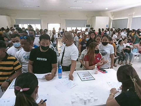 SURPRISE DRUG TEST. More than 400 job order employees of Barili town, southwest Cebu, gather at the town hall's conference room for a surprise drug test on Tuesday, August 2, 2022. Only one out of the 464 job order personnel tested positive for drug use. (Barili Information Office)