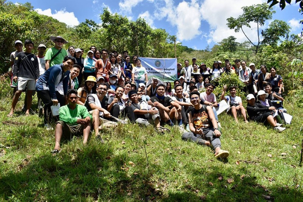 TREE PLANTING. CHMSU volunteers plants 190 endemic tree seedlings and monitors more than 600 growing trees planted during previous visits at Gawahon Eco-Park, Victorias City in celebration of Earth Day. (Contributed photo)