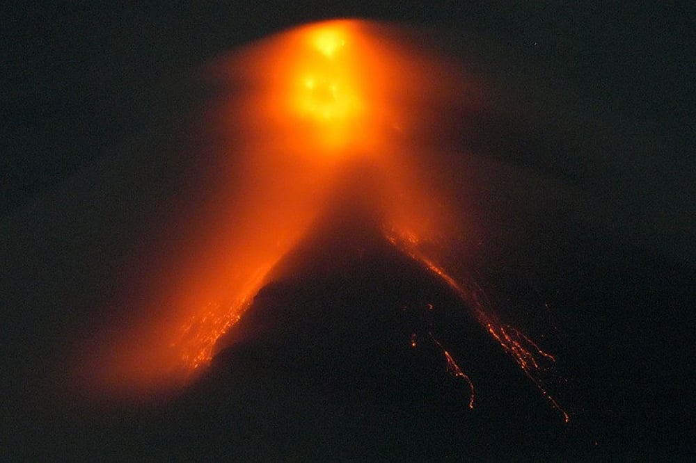 Mayon Volcano spews lava down its slopes in gentle eruption putting  thousands on alert
