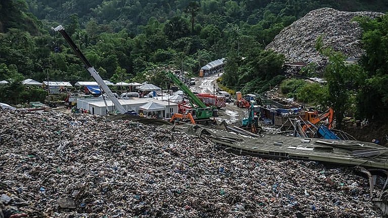 Trucks continue hauling days after deadly Cebu landslide