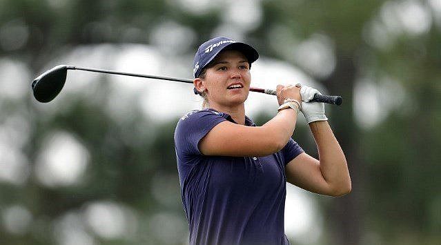 Green makes ace, takes share of lead