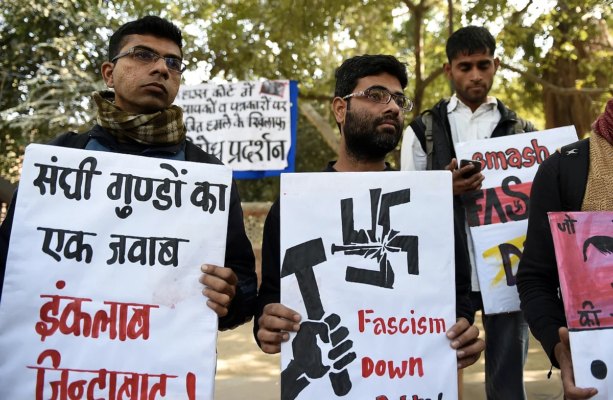 Indian activists of the DISHA Students Organistion hold placards against the February 15, 2016 attack on JNU students and teachers at Patiala House court, during a protest in New Delhi on February 16, 2016. Indian students,teachers and activists are protesting against the arrest of a top university student leader after he was charged with sedition, and demanding his immediate release. AFP PHOTO / Prakash SINGH / AFP / PRAKASH SINGH        (Photo credit should read PRAKASH SINGH/AFP/Getty Images)