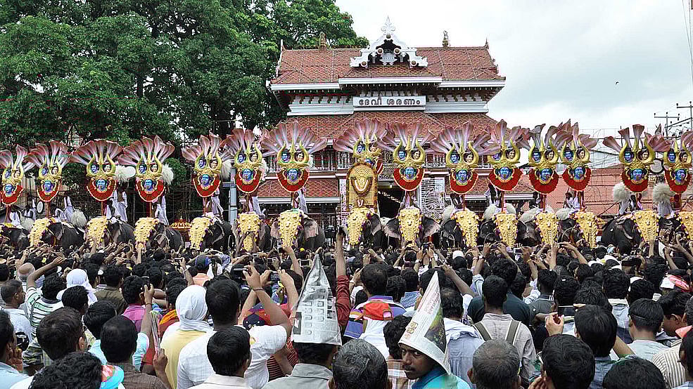 Thousands of Pooram fans watch the processions led by caparisoned
elephants in front of Vadakkunnathan
Temple in  Thrissur. Photo
credit: STRDEL/AFP/GettyImages
