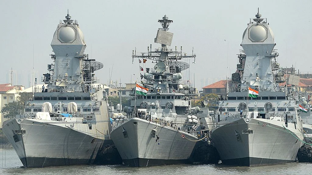 Indian naval sailors
on a rubber inflatable boat pass naval warships at the Naval Dockyard in
Mumbai. Photo credit: INDRANIL MUKHERJEE/AFP/GettyImages