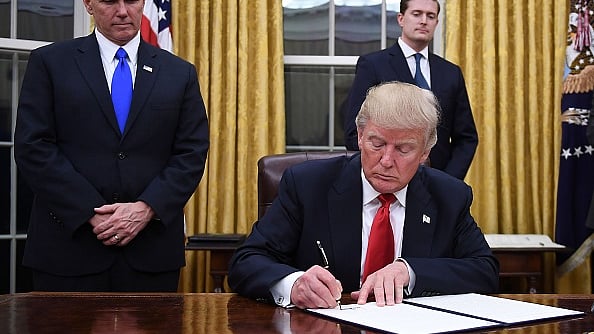 US President Donald Trump signs an executive order at the White House in Washington, DC. (JIM WATSON/AFP/Getty Images)
