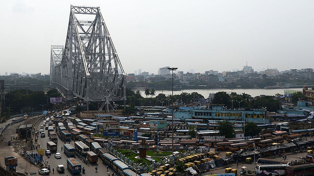 

Public vehicles wait for passengers in the depot near Howrah bridge. (DIBYANGSHU SARKAR/AFP/GettyImages)