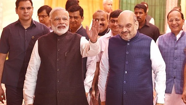 Prime Minister Narendra Modi and BJP president Amit Shah arrive at BJP headquarters in New Delhi. (Raj K Raj/Hindustan Times via Getty Images)
