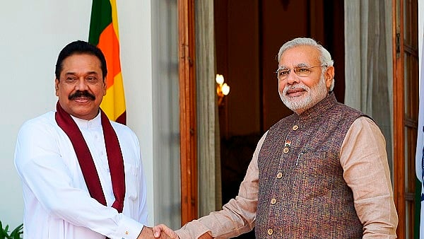 PM Modi (right) with Mahinda Rajapaksa (left) (Yasbant Negi/India Today Group/Getty Images)