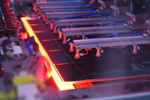 As module formats diversify and electrical configurations become more complex, layup and bussing stations are evolving to handle greater variability and programmable control. (Photo Credit: AIKO Solar) 