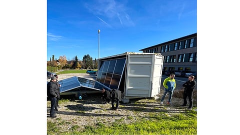 ALUMERO’s Solarfold uses a semi-automatic electric drive to unfold pre-wired PV modules from a container onto anchored aluminum rails. (Image Credit: ALUMERO)