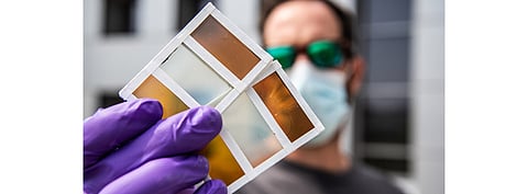 The NREL team believes thermochromic photovoltaic windows, that now can be developed into various colors, can lower the energy use of buildings while turning these into energy generators. (Photo Credit: Dennis Schroeder/NREL)