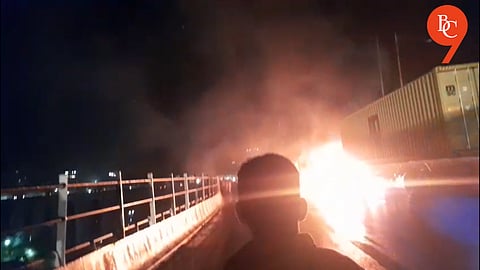 A container truck caught fire near the Jambhulwadi bridge on the Pune–Satara highway around 12:30 AM.