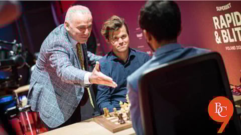 Garry Kasparov alongside Magnus Carlsen courting D Gukesh