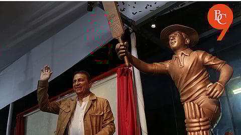 Sunil Gavaskar alongside his statue