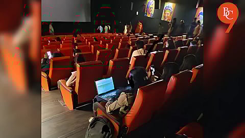 Woman Spotted Working on Laptop Inside Movie Theatre; Viral Clip Sparks Debate on Bengaluru's Hustle Culture