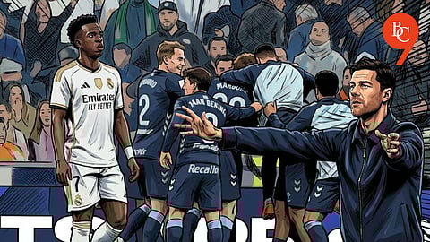 Vinicius Jr. and Xabi Alonso, as Celta Vigo players celebrate the second goal