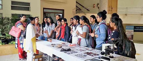 Students show keen interest in cancer research during Open Day at NCCS