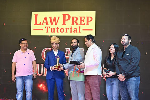 Founder Sagar Joshi, Law Prep Tutorial NCR Director Mr. Anand Sharma with Priyam Rastogi, Eikluvya Murray Felicitating AILET 2026 Topper Aryan Singh