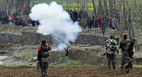 Budgam: Local protesters try to disrupt an anti-militant operation at village Durbugh in Chadoora area of central Kashmir's Budgam district on Tuesday. One militant and three civilians were killed in the operation. PTI photo by S Irfan  