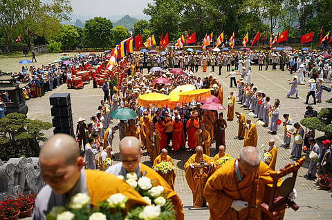 Devotees pay homage to the sacred relics of Lord Buddha at Bai Dinh Pagoda in Vietnam