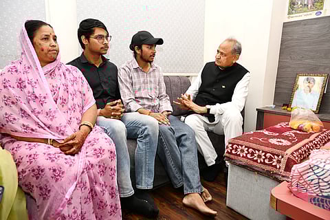 Gehlot with Kanhaiya Lal's wife and sons. 
