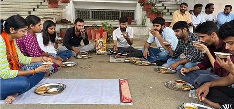 Students staging dharna outside the university's administrative block. 