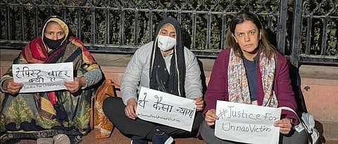 The rape survivor with her mother (L) and activist Yogita Bhayana (R) staged a sit in protest after the Delhi HC suspended the life imprisonment sentence of MLA Kuldeep Singh Sengar. 