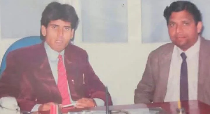Dr. Rashid (in red tie on left) when he treated people.