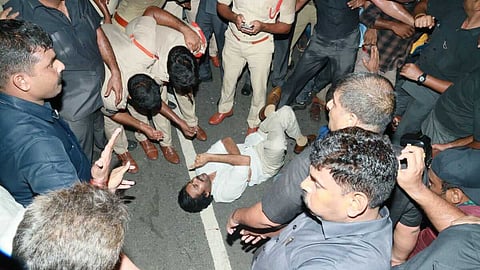 Jana Sena Pawan Kalyan lies on the road in protest against AP police in Anumanchipalli, Andhra Pradesh. 