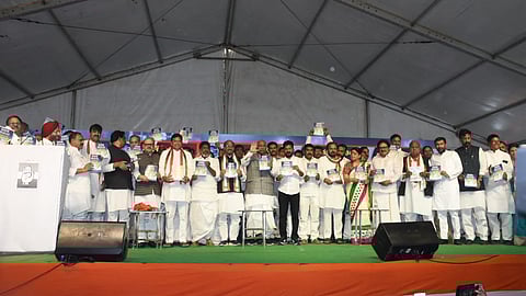 Congress national president Mallikarjun Kharge and Telangana Congress leaders with the manifesto