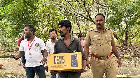 Masood, the father of the deceased baby carrying the corpse in a cardboard box
