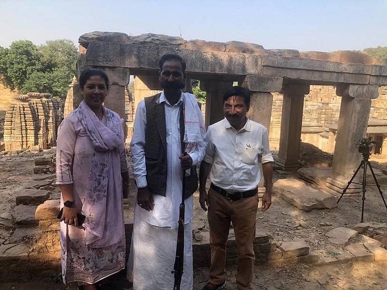 KK Muhammed with his wife at one of the Bateshwar temples under renovation. In the middle, a Chambal dacoit who turned a security guard.