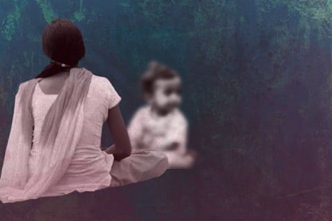 A woman sits cross-legged with their back to the camera, facing a blurred child, against a textured, abstract background.