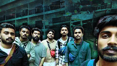 Seven men standing together, with a backdrop of a building and dimly lit interior scenes resembling office workstations.