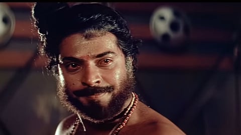 A screenshot of actor Mammootty as Chandu in the Malayalam movie Oru Vadakkan Veeragatha