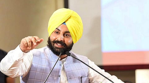 Punjab State Education Minister Harjot Singh Bains talking into a mic