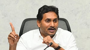 YSR Congress President and former Andhra Pradesh Chief Minister YS Jagan Mohan Reddy in a white shirt speaking into a mic