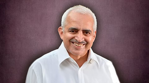 featuring Anand Kumar, wearing a white shirt. 