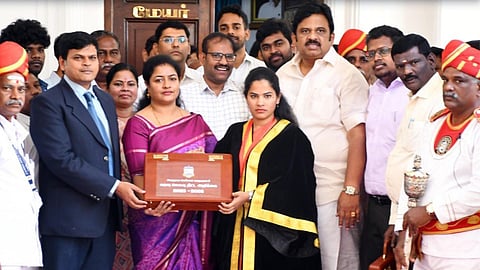 Greater Chennai Corporation Commissioner Kumaragurubaran (left), Taxation and Finance Committee Chairman Sarbajaya Das( centre), Mayor Priya (right) and Deputy Mayor Mahesh Kumar (right), standing together, holding a box that reads Greater Chennai Corporation Budget 2025-2026.