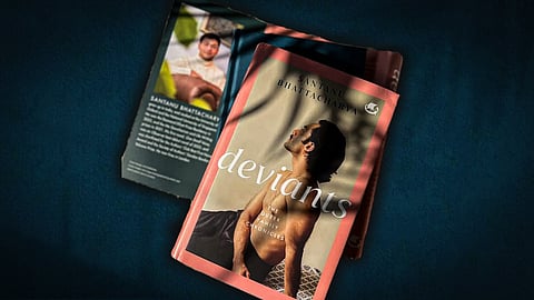 A close-up shot of Santanu Bhattacharya's book 'Deviants' on a dark, textured surface. The book cover shows a shirtless man with his head tilted back. A folded flyer with the author's photo and details about the book is also visible.