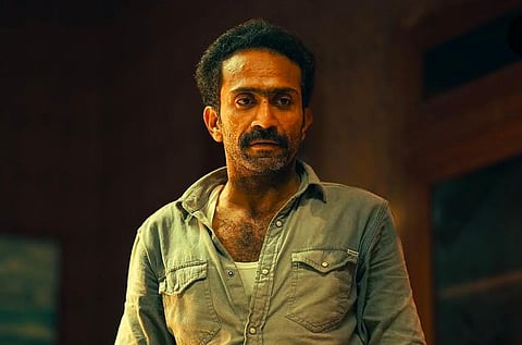 Image featuring Shine Tom Chacko wearing a blue shirt. 