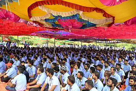 Workers' of Samsung Indian sit in a protest site under a colourful pandhal