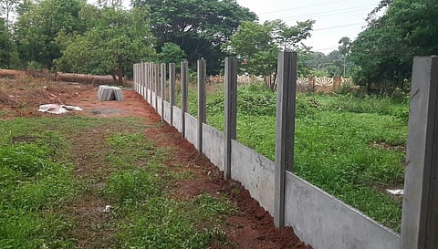 Image featuring the compound wall construction at the crematorium. 