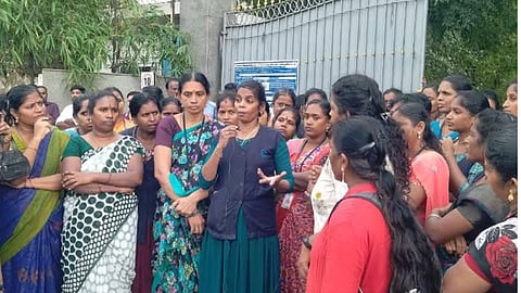 Group of women garment workers in Chennai gathered outside factory gate during protest over closure of Celebrity Fashions’ Avadi unit.