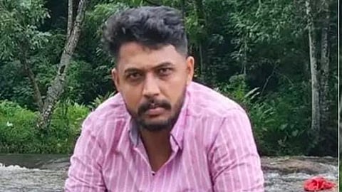 Image featuring Ansil, wearing a pink shirt 