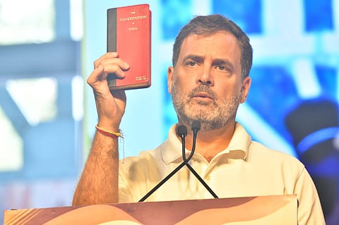 Congress leader Rahul Gandhi held up a copy of the Constitution, saying it's foundational idea was that of one man, one vote, as he spoke about alleged voter fraud during the last Lok Sabha election. 