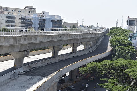 The metro line will run above the flyover, following the model of the existing double-decker section from Ragigudda to Silk Board Junction.