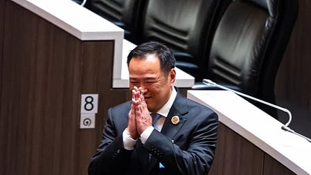 Bhumjaithai Party leader Anutin Charnvirakul bows after he was elected Thailand's new prime minister at the parliament