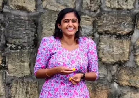 Image featuring Meera, wearing a pink dress 